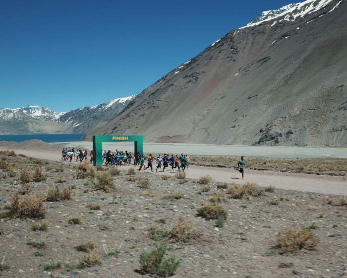 man running through finish line