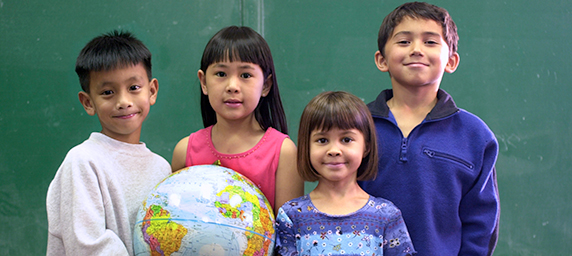 kids holding globe