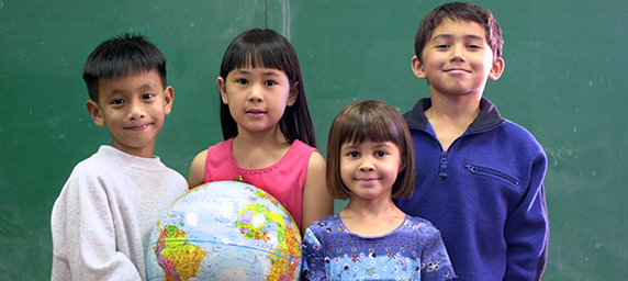 kids holding globe