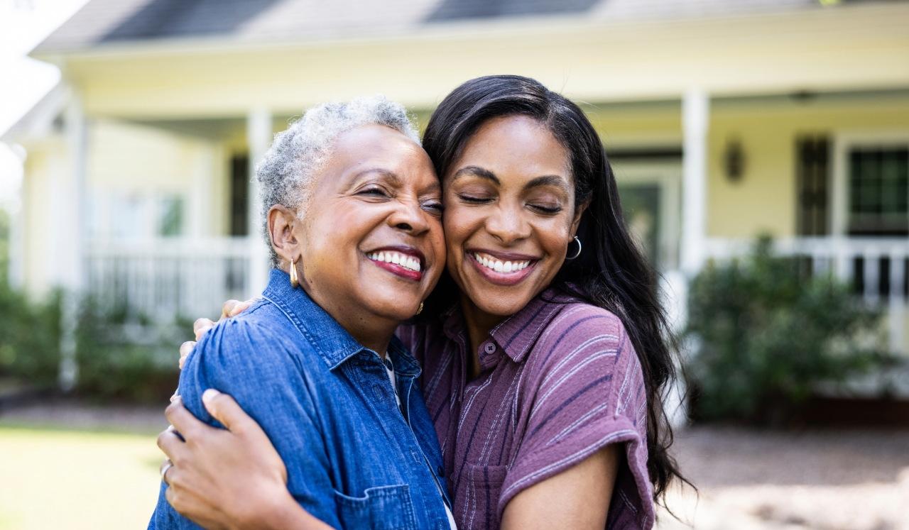 Two women embracing.