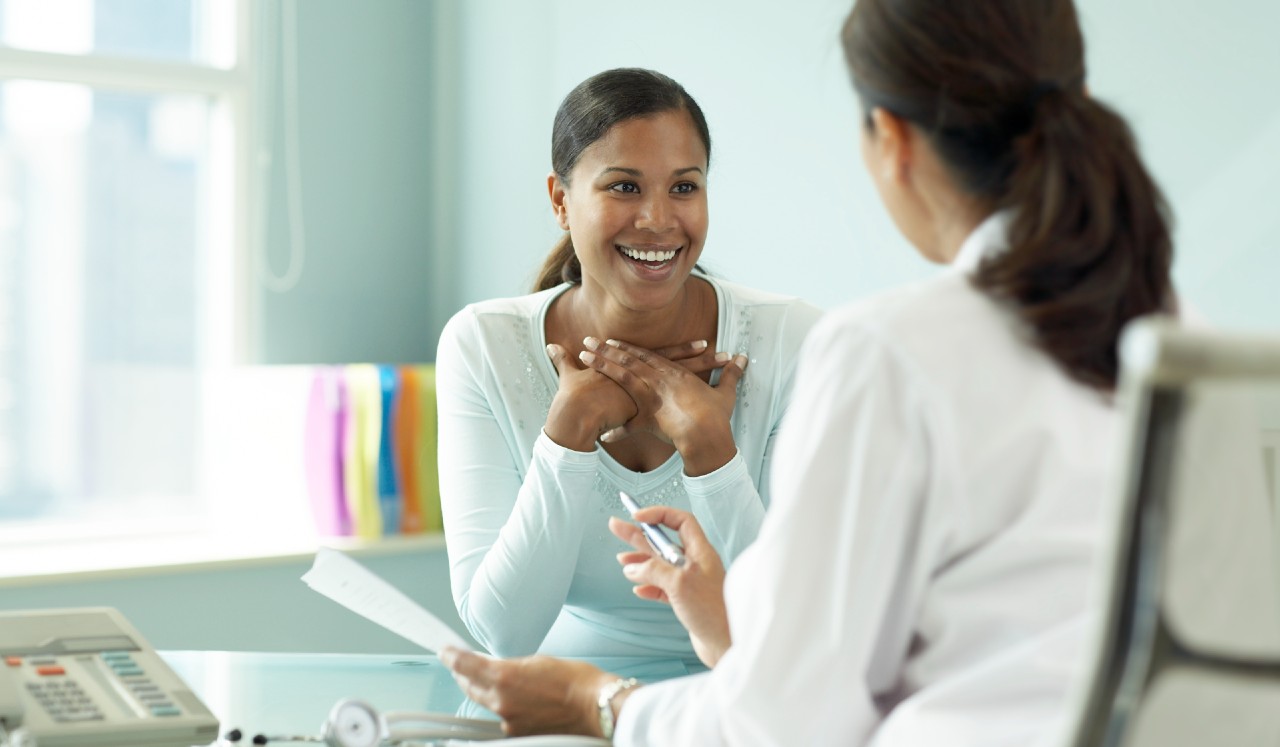 Woman with doctor discussing diagnosis