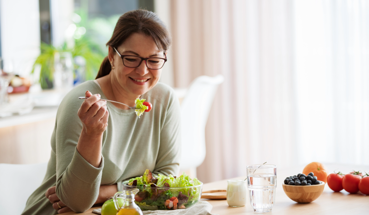 Woman eating salad