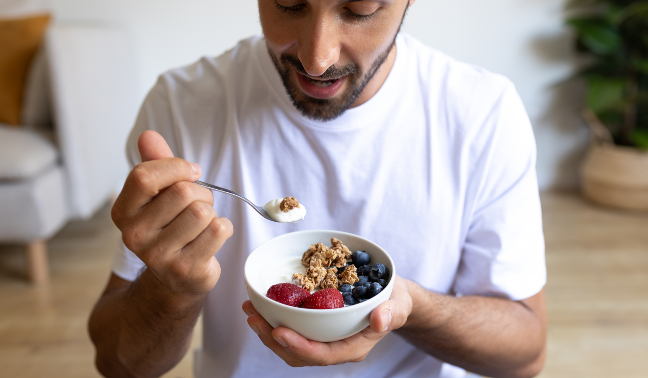 Man eating yogurt bowl