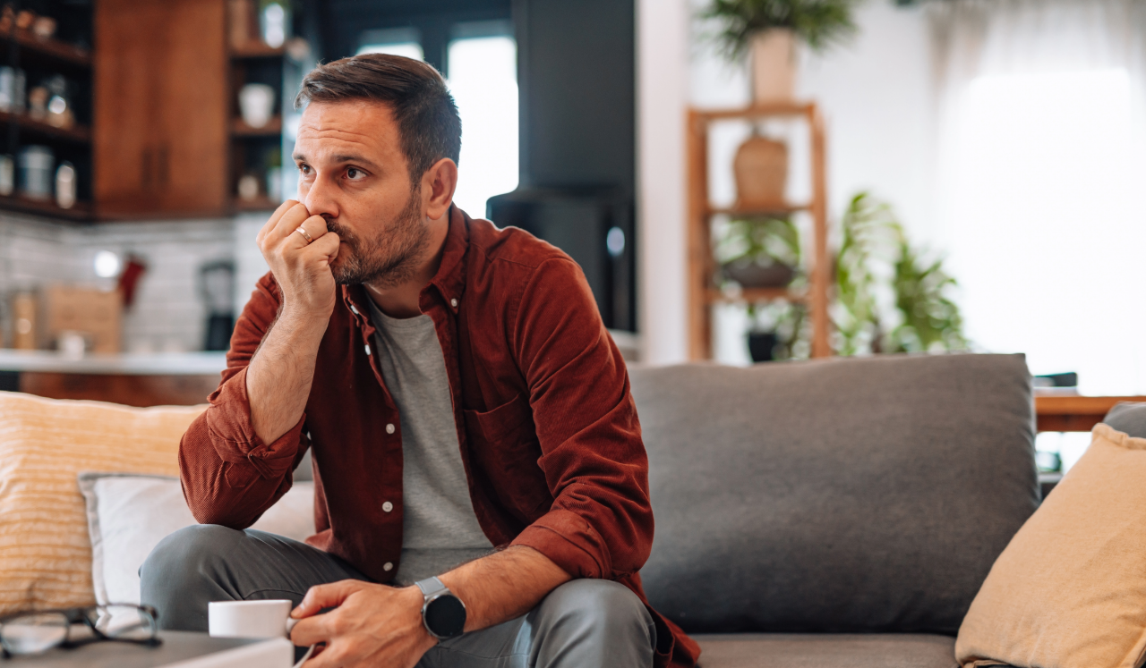 Man looking stressed and overwhelmed.
