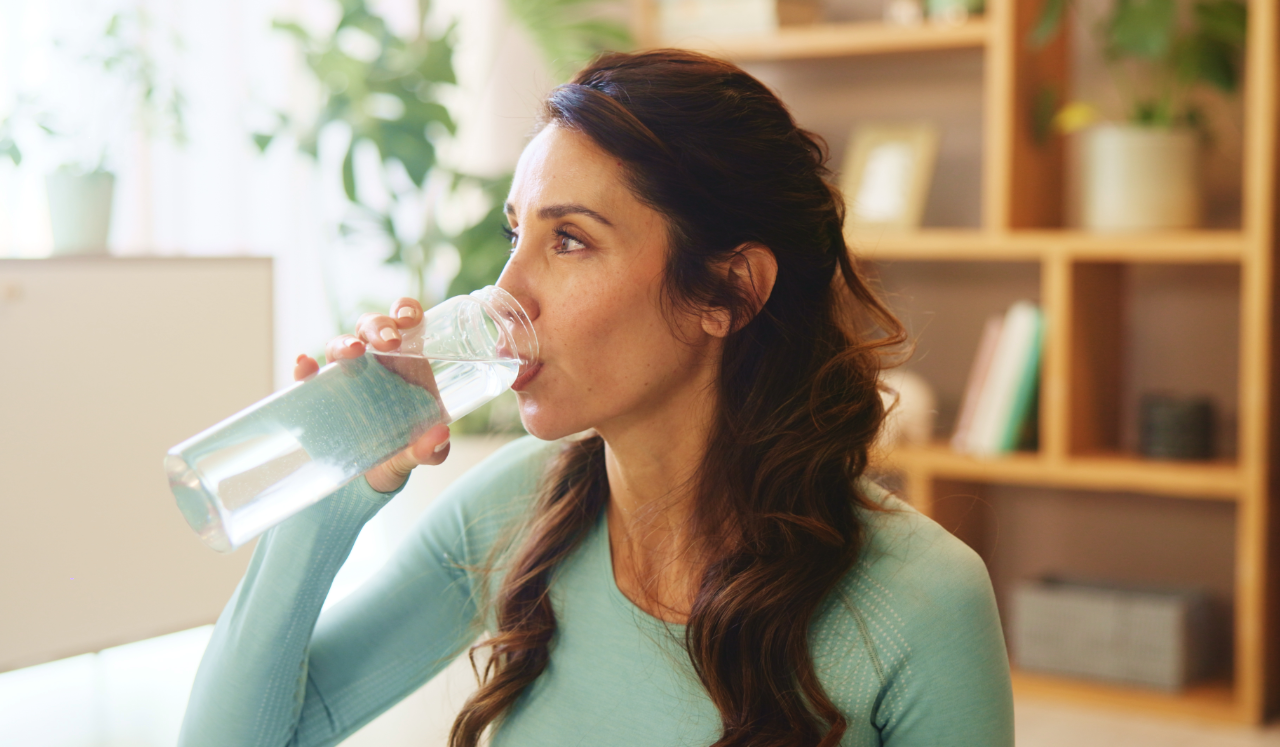 Woman drinking water.