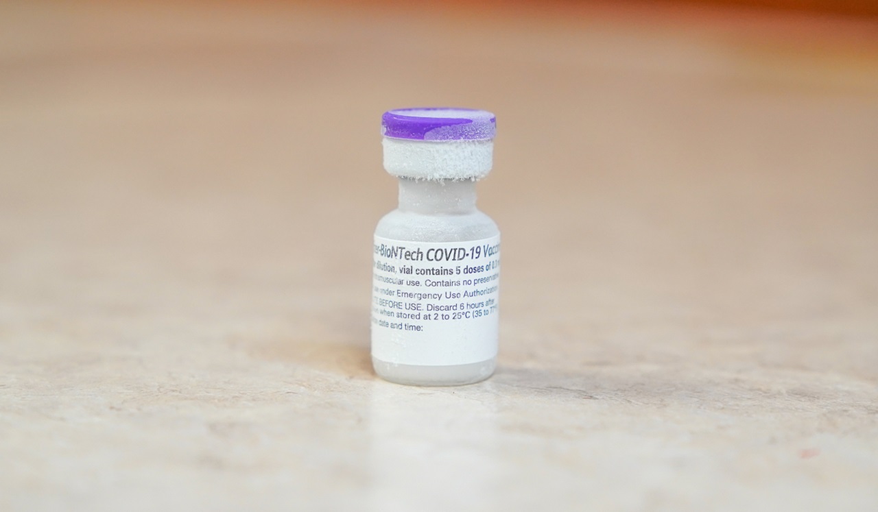 A bottled COVID-19 vaccine fresh from the freezer