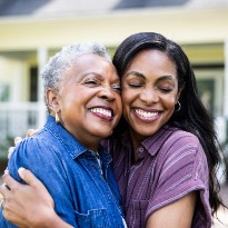 Two women embracing.