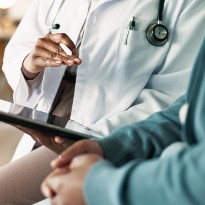 Doctor talking with patient