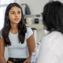 Young women talking with their medical provider