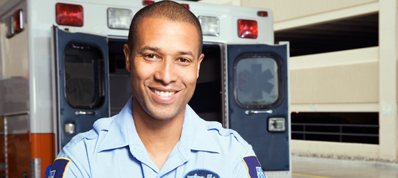 Paramedic in front of ambulance