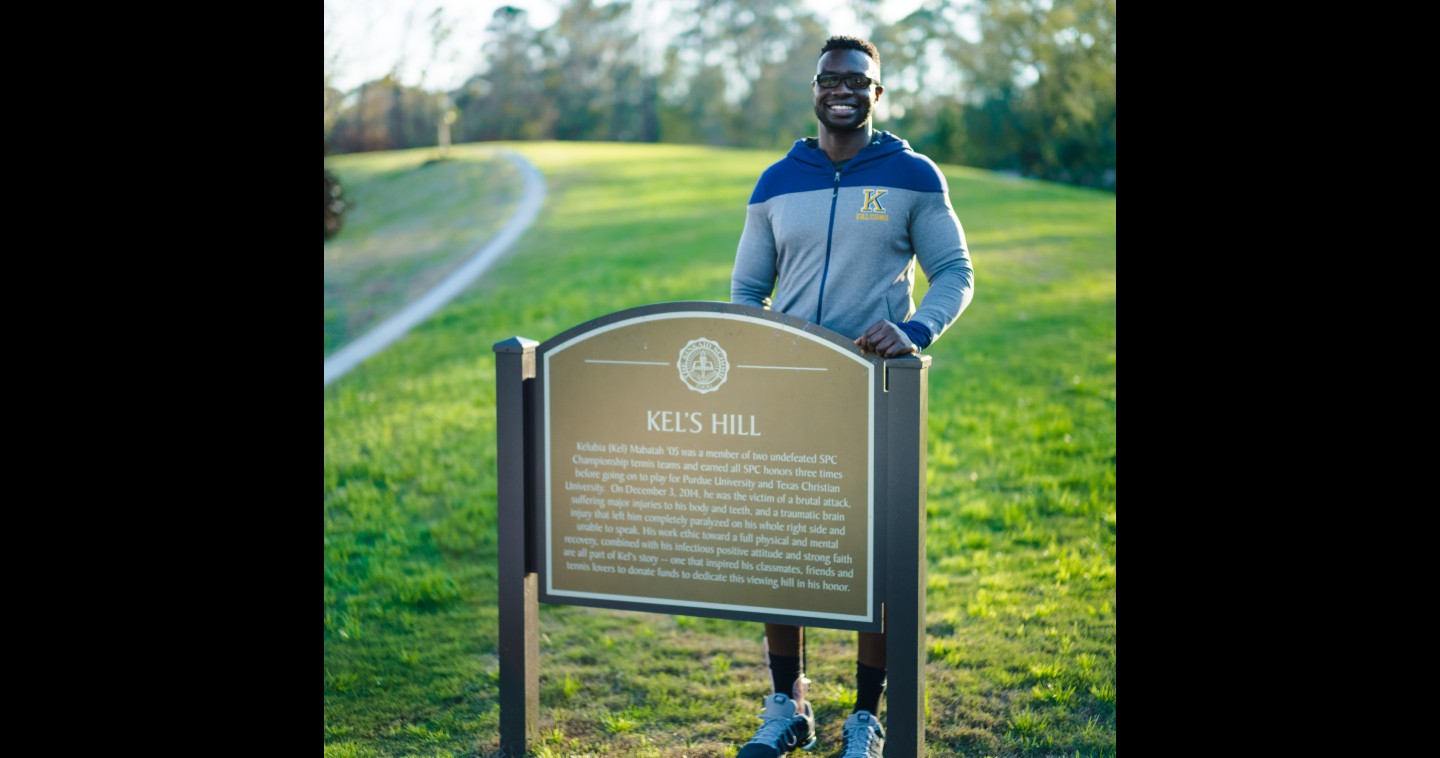 Kel at Kel's Hill sign