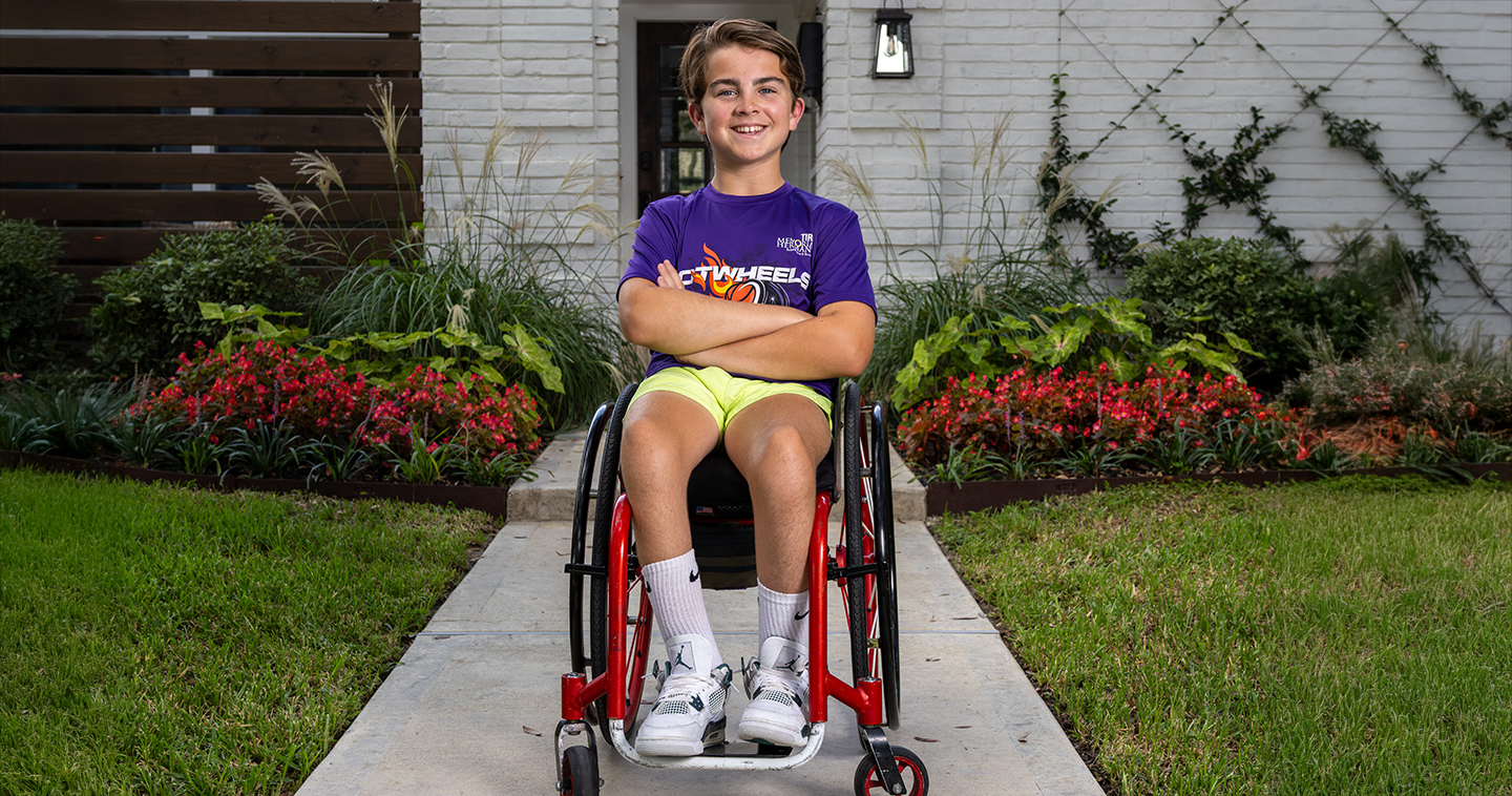 Oliver sitting in wheelchair