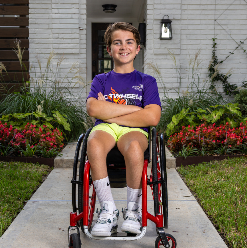 Oliver sitting in wheelchair