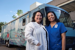 Mobile dental van with two employees