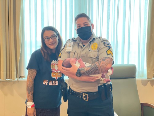Morgan Lee and baby with Security Officer