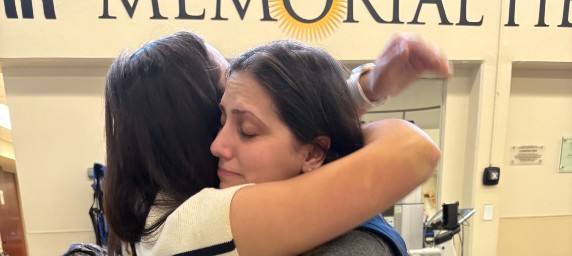 Former patient of TIRR Memorial Hermann, Dawson Oliver, gives hugs as she leaves inpatient therapy.
