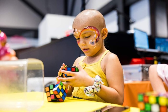 patient mya playing with a rubik's cube