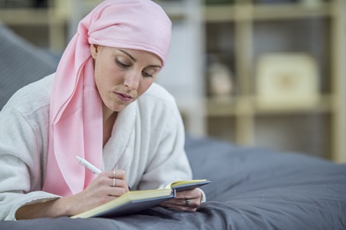 Elisa writing in her journal
