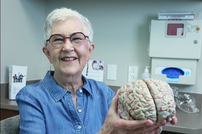 patient phyllis lair holding brain
