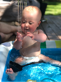 Baby playing in water
