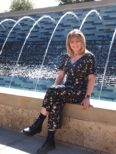 Jaclyn Pellicotte smiling in front of a fountain