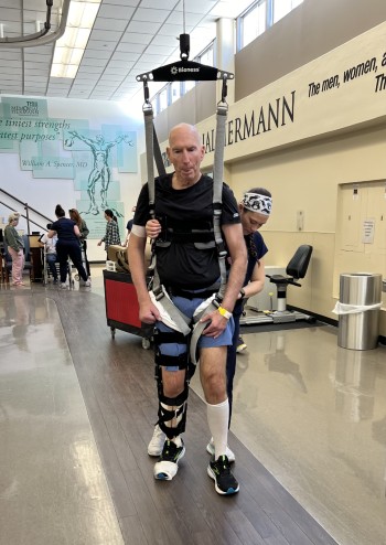 TIRR Memorial Hermann patient John Eidman works with assistive devices through rehabilitation. 