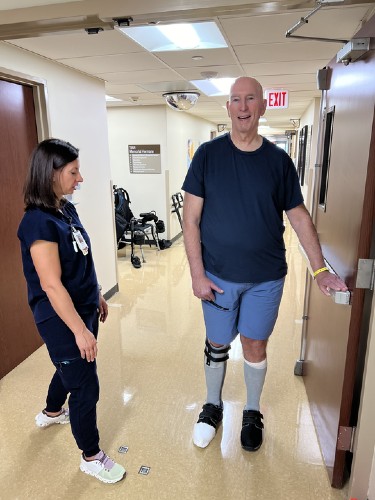 TIRR Memorial Hermann patient, John Eidman, works with therapists at TIRR.