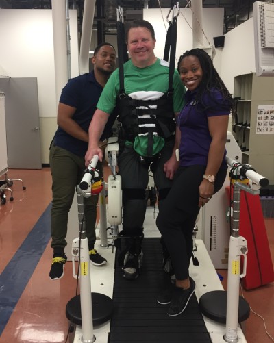 TIRR Memorial Hermann patient, Mark Neagli, works with assistive devices and physical therapists. 