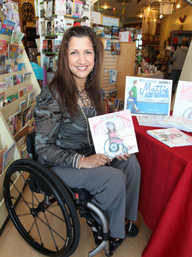 Meena Outlaw poses with her book