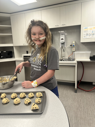 TIRR Memorial Hermann patient, Eleanor, bakes with Child Support.