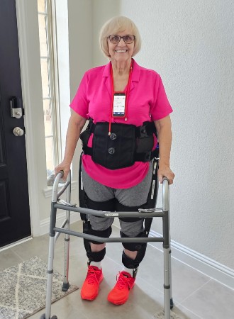 TIRR Memorial Hermann patient, Shirley Crump, shows off her exoskeleton.
