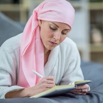 Elisa writing in her journal
