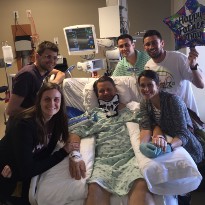 TIRR Memorial Hermann patient, Mark Neagli, is surrounded by his children while in inpatient care. 