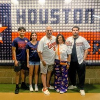 TIRR Memorial Hermann former patient, Armando Rodriguez, with has family at an Astros game.