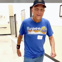 TIRR Memorial Hermann patient, Ed Watkins, walks the hallways after lymphedema management.