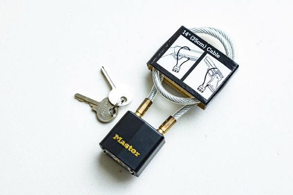 hand pressing keypad lock