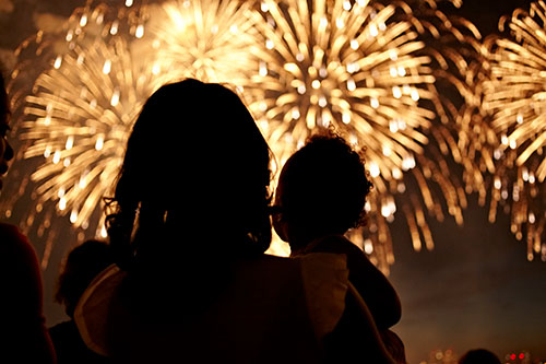 Mother and child watching fireworks