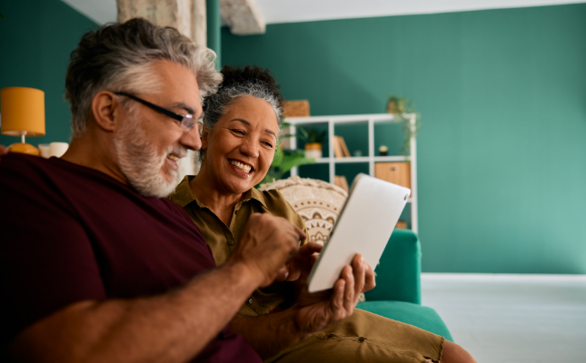 Couple taking quiz on tablet