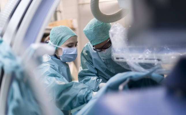 Surgeons in operation