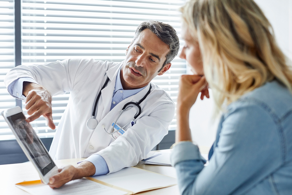 Doctor and patient looking at scan