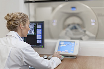 Woman Operating MRI