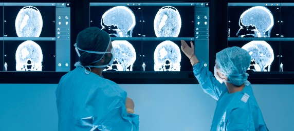 surgeons reading scans