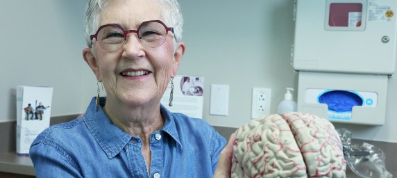 patient holding brain