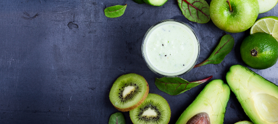 Ingredients for a sauce are featured, including sliced kiwi, avocado, green apple and limes.