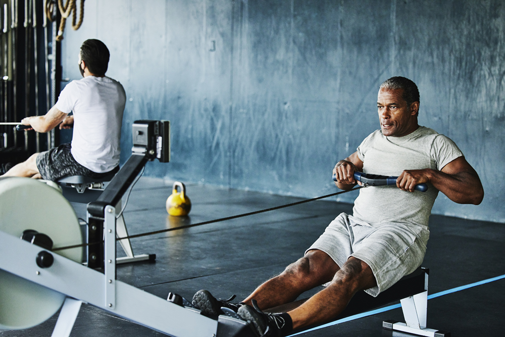 Man working out on rowing machine