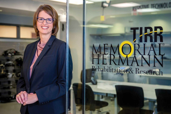 Rhonda Abbott, TIRR Memorial Hermann CEO, stands by inpatient rehabilitation entrance. 