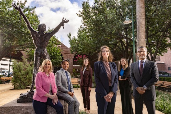 TIRR Memorial Hermann leadership team stands proudly at the entrance to the rehabilitation facilities.