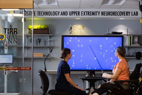Two individuals sit at the Learning Health System