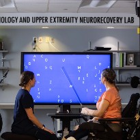 Two individuals sit at the Learning Health System