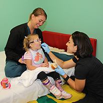Sabrina Filoteo Salinas Feeding A Child